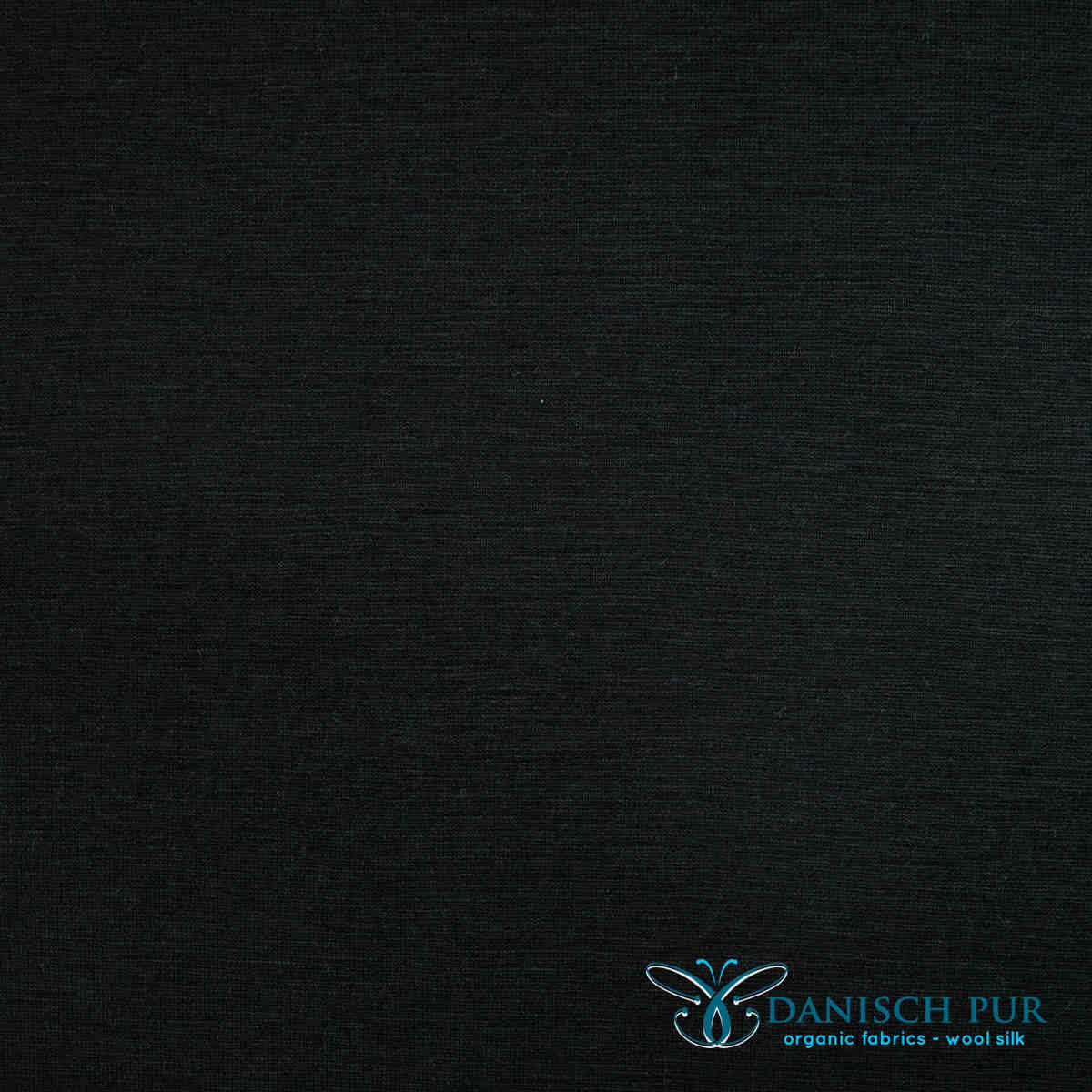 Fine organic wool cuffs black (kbt, mulesing-free) in a tube