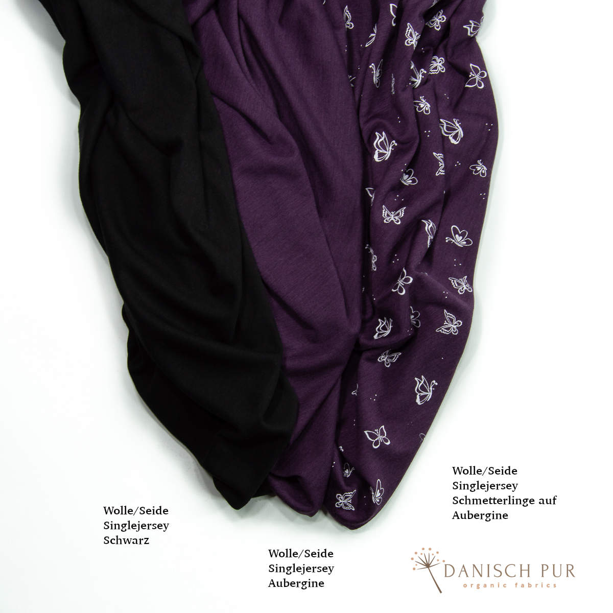 Singlejersey Bio Wolle Seide Schmetterlinge auf Aubergine (70% Schurwolle Merino, kbt, mulesingfrei, 30% Seide)