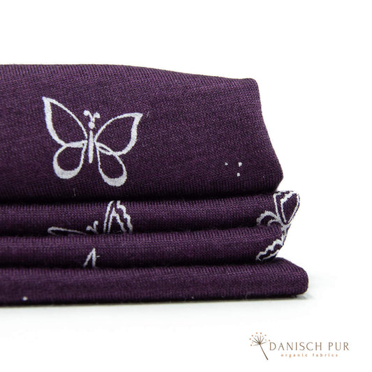 Singlejersey Bio Wolle Seide Schmetterlinge auf Aubergine (70% Schurwolle Merino, kbt, mulesingfrei, 30% Seide)